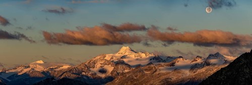 Full moon over summit of Oetztaler Wildspitze