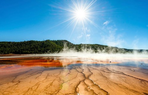 Steaming hot spring with sun star