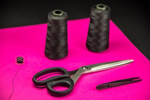 Black tailoring accessories as scissors