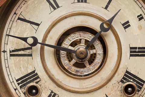 Worn vintage antique clock face and mechanism