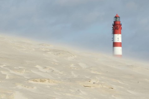 Lighthouse in dune landscape