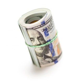 Abstract roll of newly designed U.S. one hundred dollar bills isolated on a white background