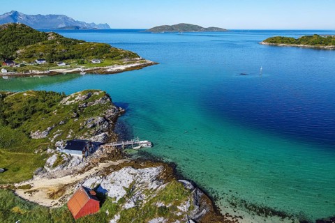 Aerial of a remote little bay and settlement along the road to the Nordkapp