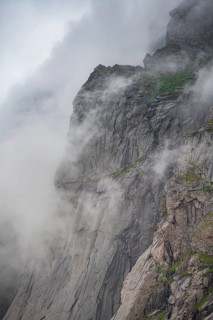 View from Helvetestinden to rock face of Mount Storskiva