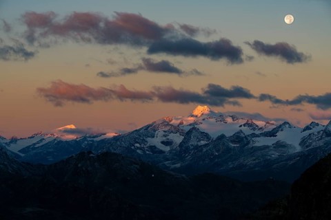 Full moon over summit of Oetztaler Wildspitze