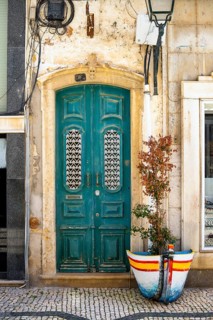 The turquoise wooden door on the promenade in Olhao