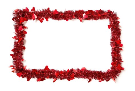 Red tinsel with hearts border frame shape on a white background ready for your own message