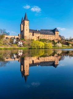 Rochlitz Castle reflected in the river Zwickauer Mulde