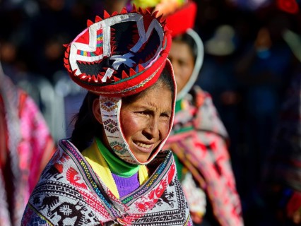 Portrait of an indigenous woman in traditional traditional costume during the parade on the eve of Inti Raymi