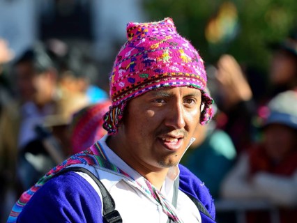 Portrait of an indigenous man in traditional traditional costume during a parade on the eve of Inti Raymi