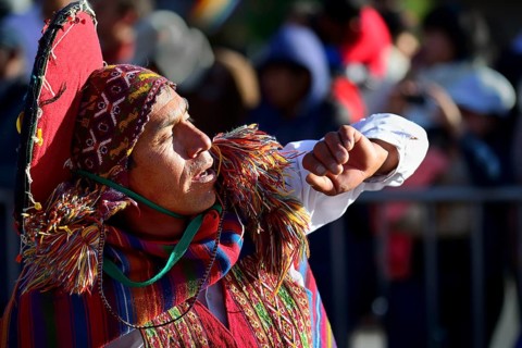 Portrait of an indigenous woman in traditional traditional costume during the parade on the eve of Inti Raymi