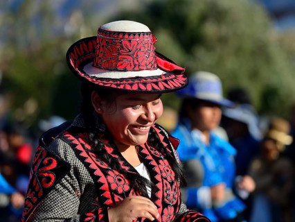 Portrait of an indigenous woman in traditional traditional costume during the parade on the eve of Inti Raymi