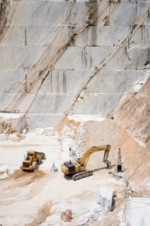 Terraced rock face in open pit Carrara marble mines or quarries