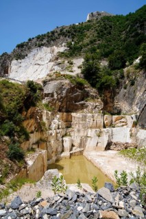 Terraced rock face in open pit carrara marble mines or quarries