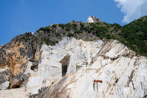 Terraced rock face in open pit carrara marble mines or quarries