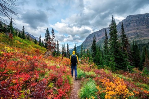 Hikers on a trail through mountain landscape