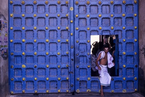 Temple priest crossing the Main door in Varadarajaswamy temple