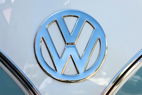 Chrome VW logo on the front of a Volkswagen Type 2 Transporter