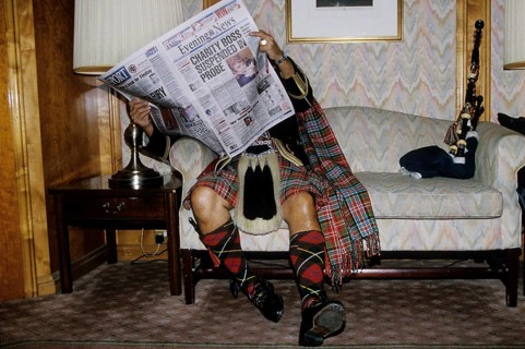 Scotsman reading newspaper