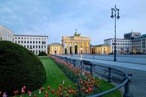 Illuminated Brandenburg Gate with Pariser Platz in the early morning