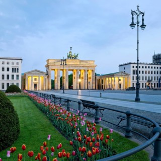 Illuminated Brandenburg Gate with Pariser Platz in the early morning