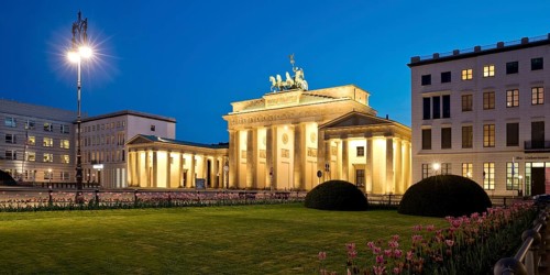 Illuminated Brandenburg Gate with Pariser Platz in the evening
