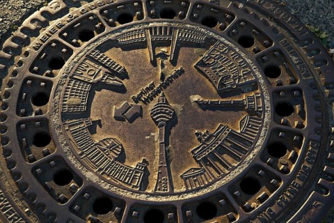 Berlin sights on a manhole cover of the Berliner Wasserbetriebe
