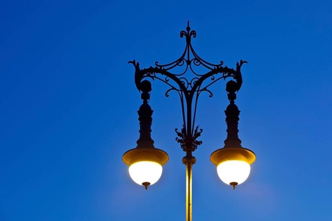 Shining old Berlin gas lantern in the evening