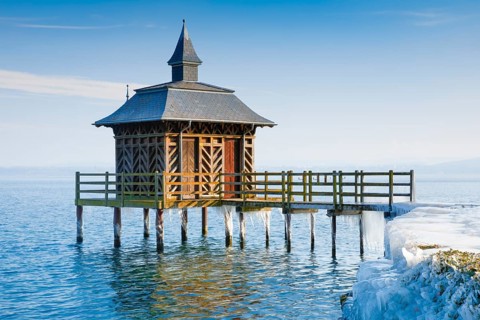 Iced wooden bathhouse on Lake Neuchatel in Gorgier