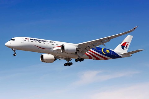 A Malaysia Airlines Airbus A350-900 with registration number 9M-MAF lands at London Heathrow Airport