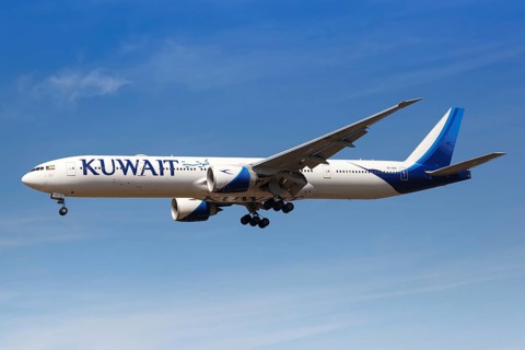 A Kuwait Airways Boeing 777-300ER aircraft with registration number 9K-AOC lands at London Heathrow Airport