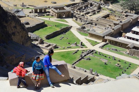 Three indigenous children in the Inca ruins