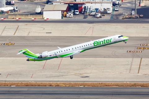 A Bombardier CRJ-1000 aircraft of Binter with registration 9H-MOX takes off from Palma de Majorca Airport