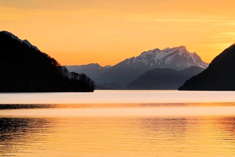 Lake with mountains in the background