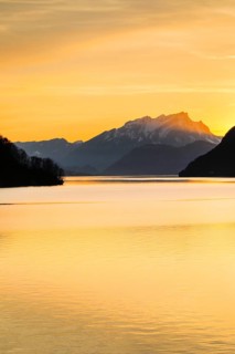 Lake with mountains in the background