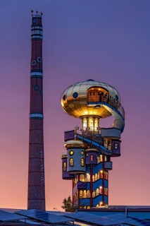 Kuchlbauer Tower or Hundertwasser Tower by Friedensreich Hundertwasser and Peter Pelican with chimney of the Kuchlbauer brewery