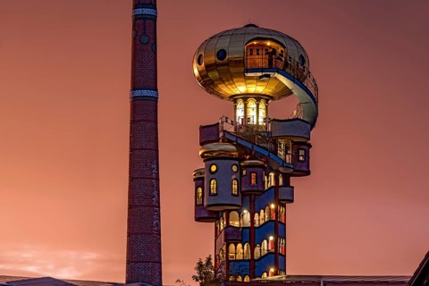 Kuchlbauer Tower or Hundertwasser Tower by Friedensreich Hundertwasser and Peter Pelican with chimney of the Kuchlbauer brewery