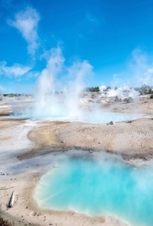 Steaming hot springs with turquoise water