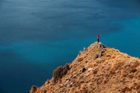 Guy on a mountain at Lake Hawea