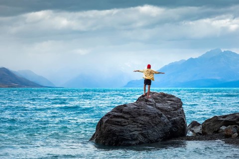Guy at a beach at Lake Tekapo