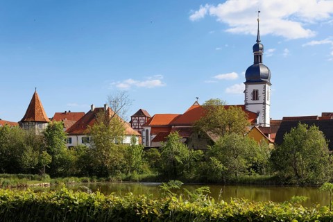 View over Breiter See on old town with church St. Sixstus