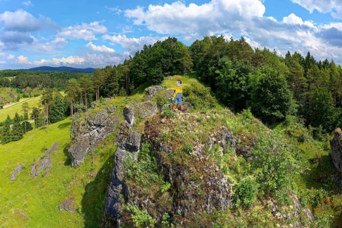 Aerial view of the rock above Oberailsfeld with cyclist figure