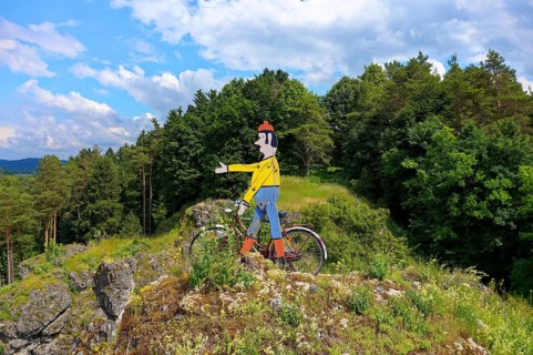 Aerial view of the rock above Oberailsfeld with cyclist figure