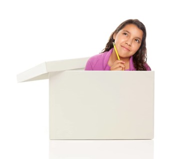 Attractive young ethnic female with pencil popping out and thinking outside the box isolated on a white background