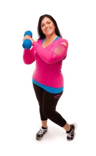 Attractive middle aged hispanic woman in workout clothes lifting dumbbell against a white background