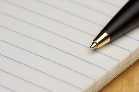 Pen and pad of lined paper