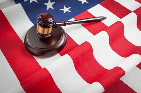 Justice gavel resting on an american flag