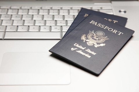 Abstract of two passports on a laptop computer keyboard