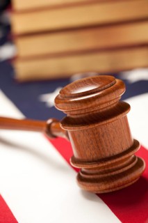 Gavel and books on the american flag with selective focus