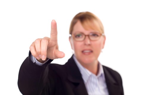 Businesswoman reaching out with finger